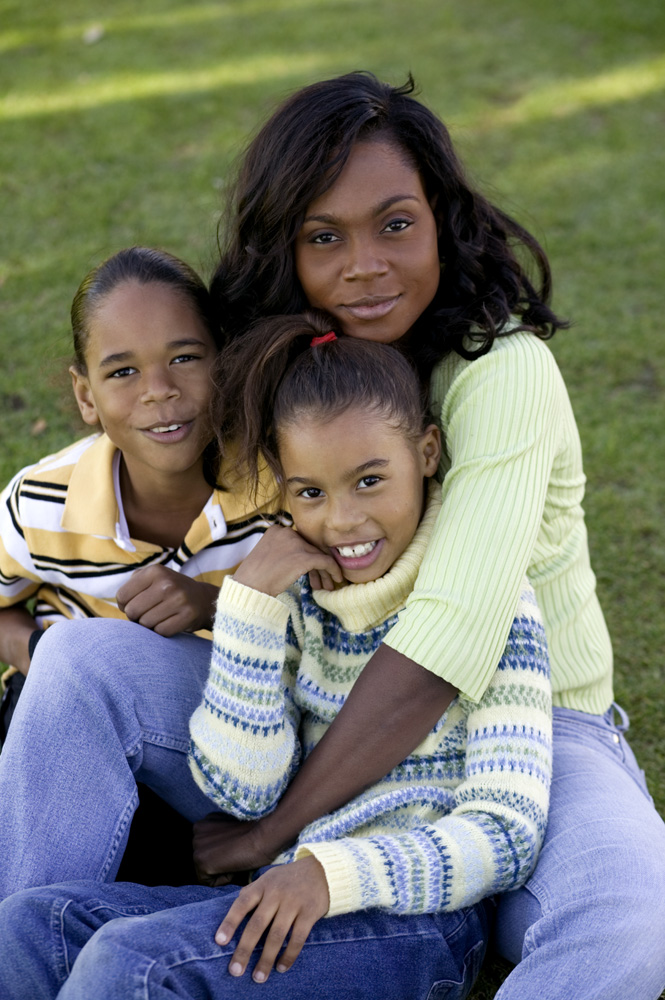 Mother with two children family portrait