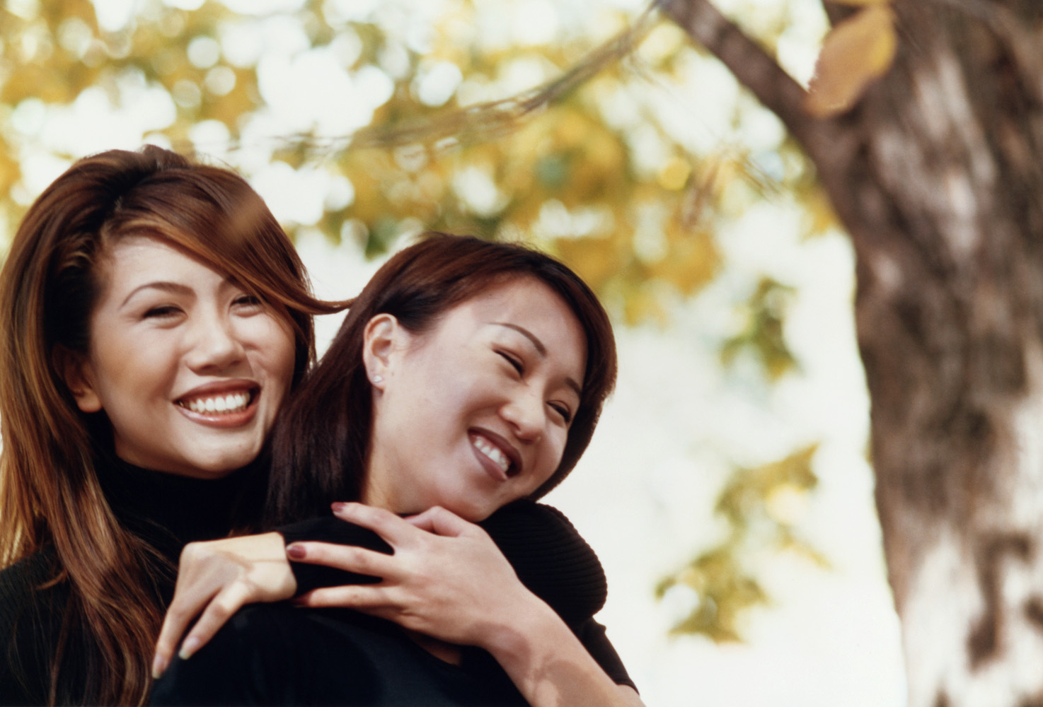 Sisters or family relationship portrait outdoors